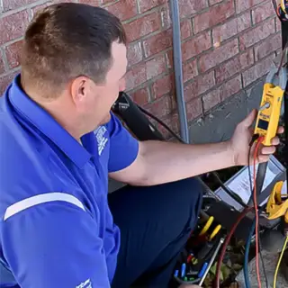Tools of the trade: Wesley Gheen diagnoses problems with a Rockwall HVAC unit.